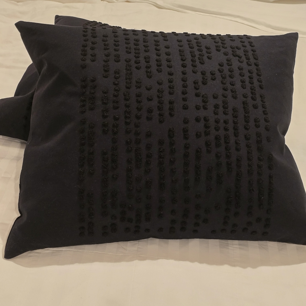Two Black IKEA Textured Throw Pillows